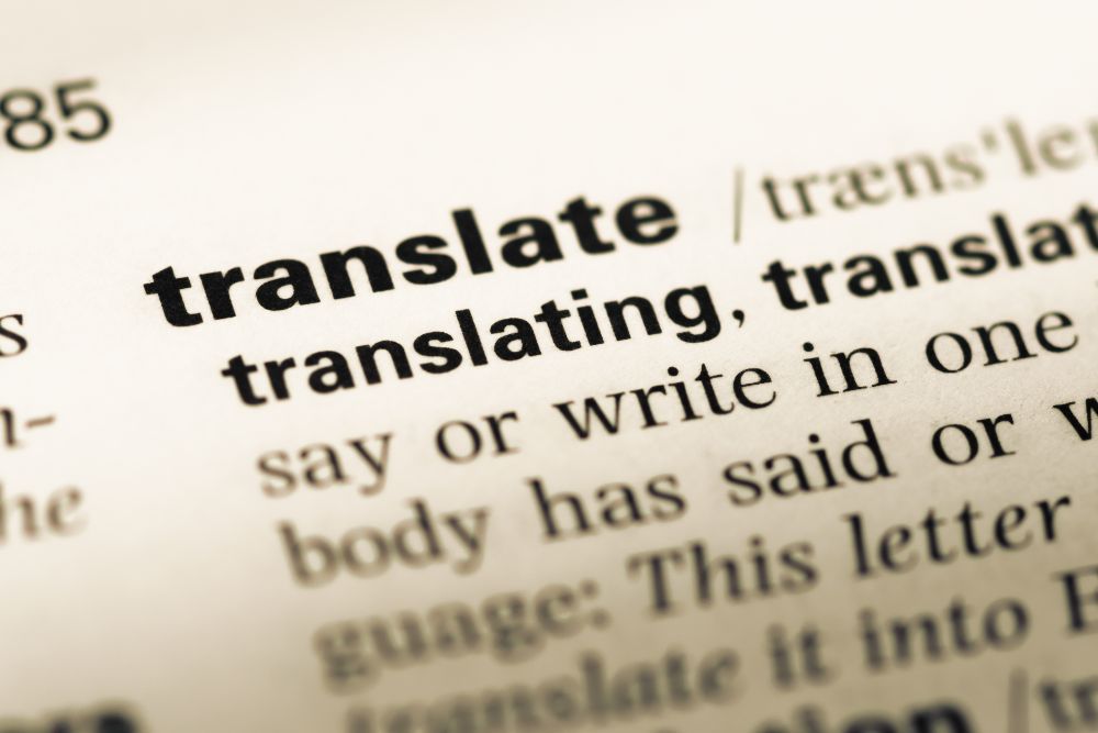 Photo of an english dictionary with the word "translate" 