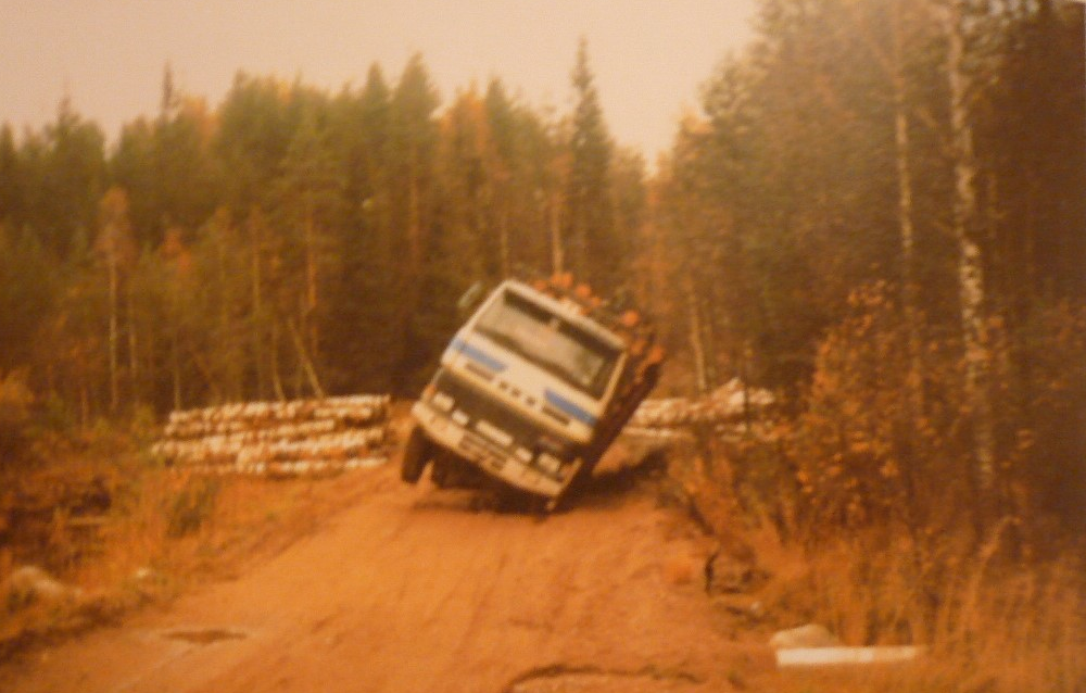 truck tipping sideways in the forest.