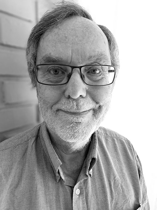 Portait of a man with glasses. Black and white photo.