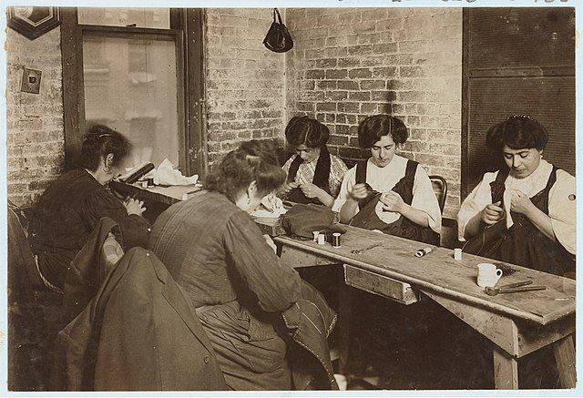 Title: Sweatshop of Mr. Goldstein 30 Suffolk St. Witness Mrs. L. Hosford. Photo of women.; Laborers.; Clothing industry.; Sweatshops.; Sewing. 