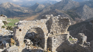 Stone ruins of a building in a mountain landscape. Photo.