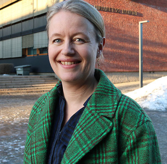 Smiling woman in green jacket