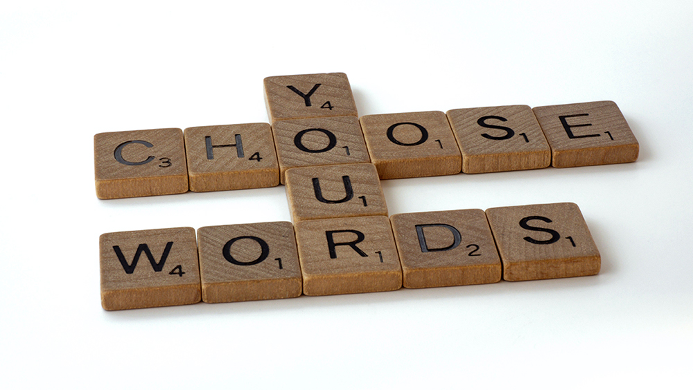 Scrabble tiles spelling "Choose your words"