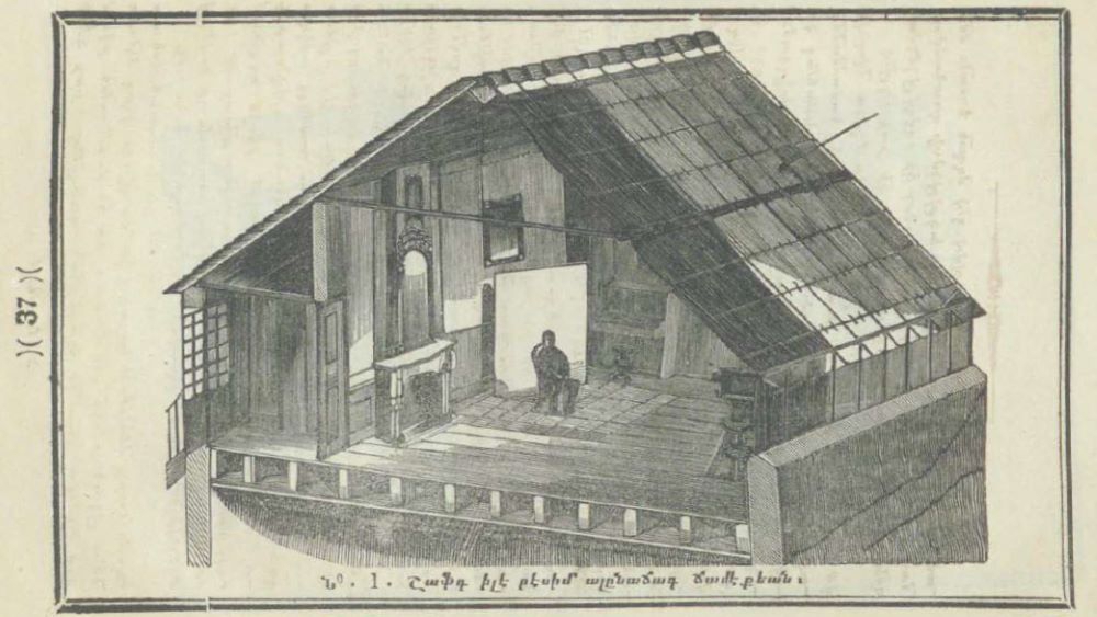 Illustration of the attic floor of a house. One wall of the house has been removed, allowing us to see the inside of the room. In the middle of the room, a person is sitting on a chair.