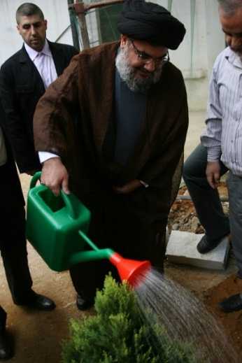 Image of Islamist leader watering trees