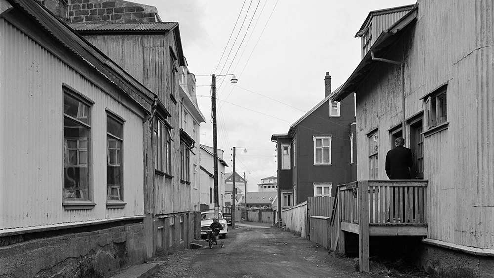 Several buildings on a street. Black and white photo. 