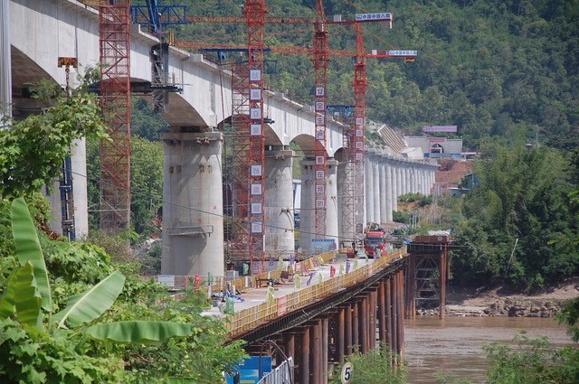 The building of a bridge over a river.