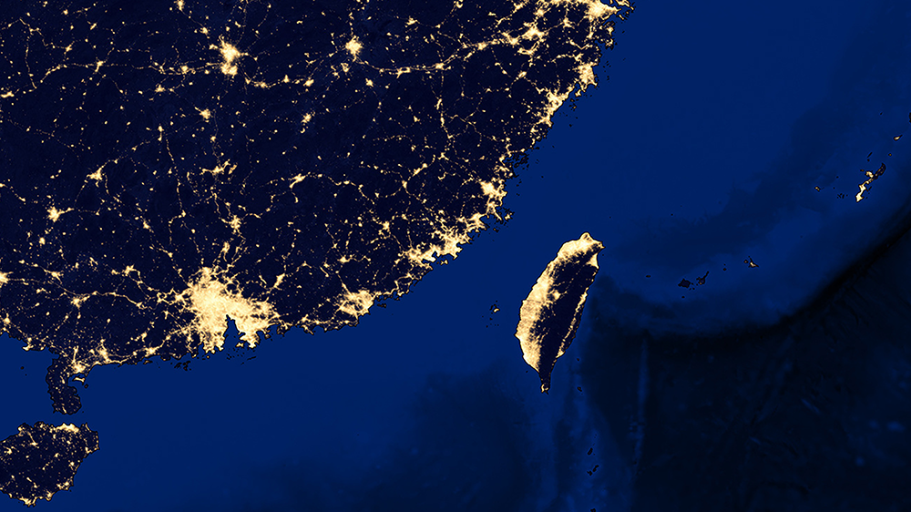 Image contains Taiwan in the bottom right and China in the top left, both illuminated by the light pollution of their cities.