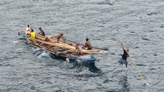 Marine hunters from the Lamalera village on Lembata Island hunt for whales. The different roles the men have are symbolically and cosmologically important, and decided by the kinship system. Here, the harpooner jumps from a long bowsprit to give added weight to the harpoon.&amp;#160;