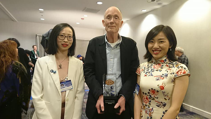 Two asian female science fiction writers, Regina Wang and Xia Jia with William Gibson 