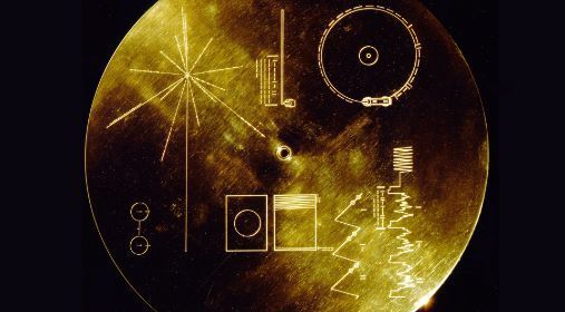 A gold record with etchings. Photo.