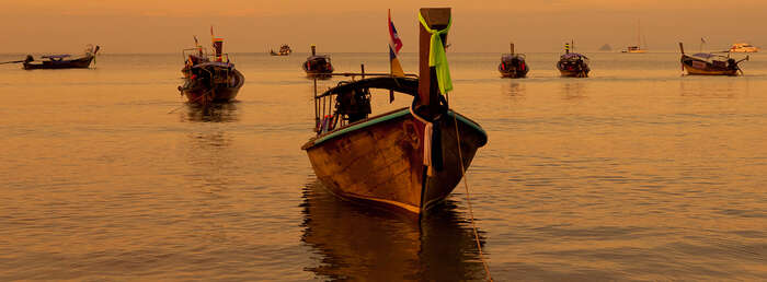 Fishing boats in the ocean in East-Asia. Heading. Photo.