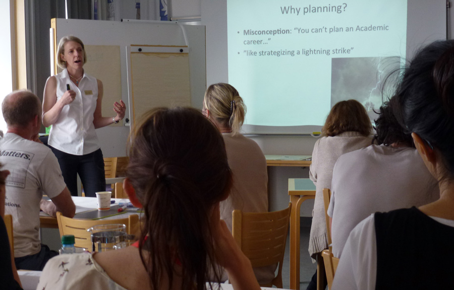 Woman holding a presentation for a group of students