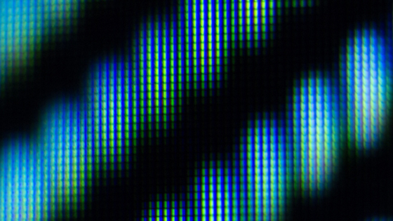 Piksler i svart, grønt og blått på en skjerm. Foto.