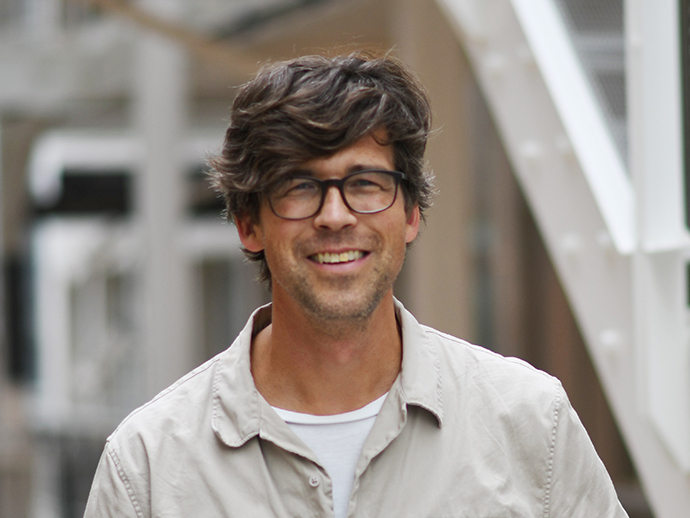 Portrait of Steffen Krüger, a smiling man with spectacles. Photo. 
