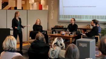 Table ,Coat ,Social group ,Interaction ,Microphone.