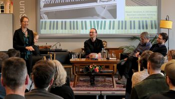 Table ,Outerwear ,Furniture ,Microphone ,Coat.