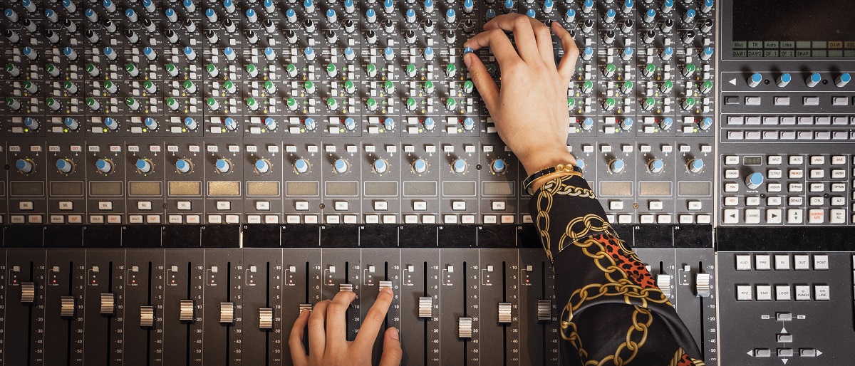Hands on mixing desk in studio, ZEB-building, IMV. Photo.
