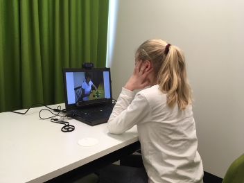 Child is doing a test with an eye tracker