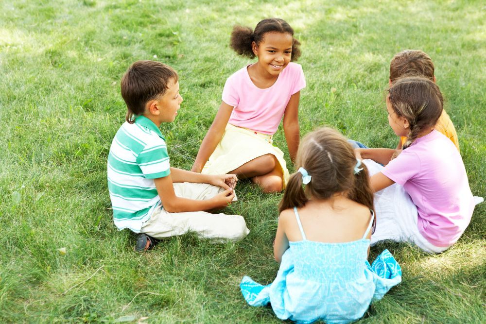 Children sitting on the grass