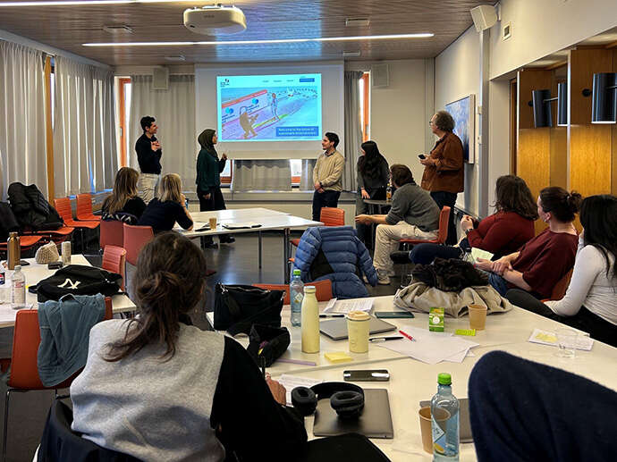 students presenting their results for an audience